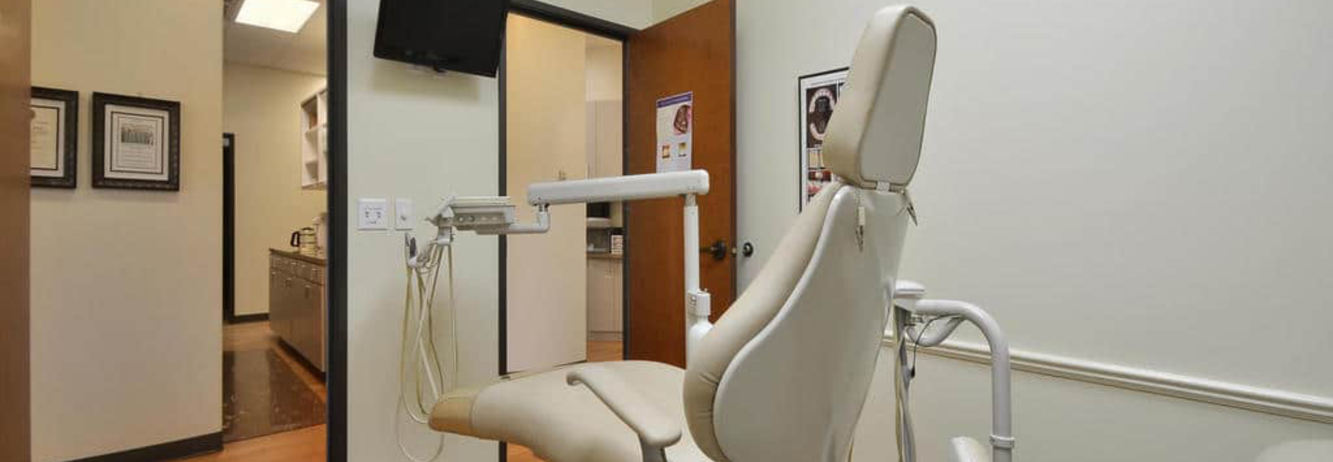 Modern dental operatory with chair, equipment, and treatment area in professional clinic setting.