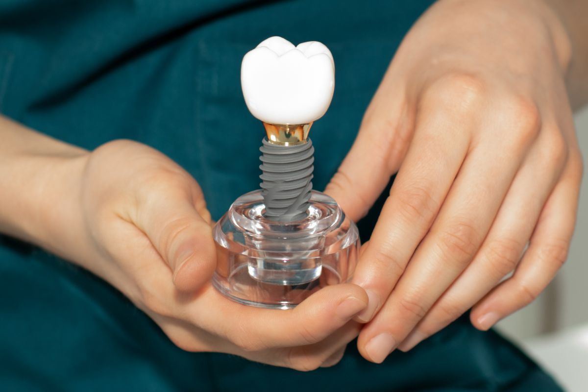 Dentist Holding Artificial Dental Implants Module